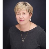 KIM E. REESOR