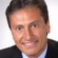 LOU J. TOMASONE