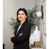 MAGGIE TAHERI