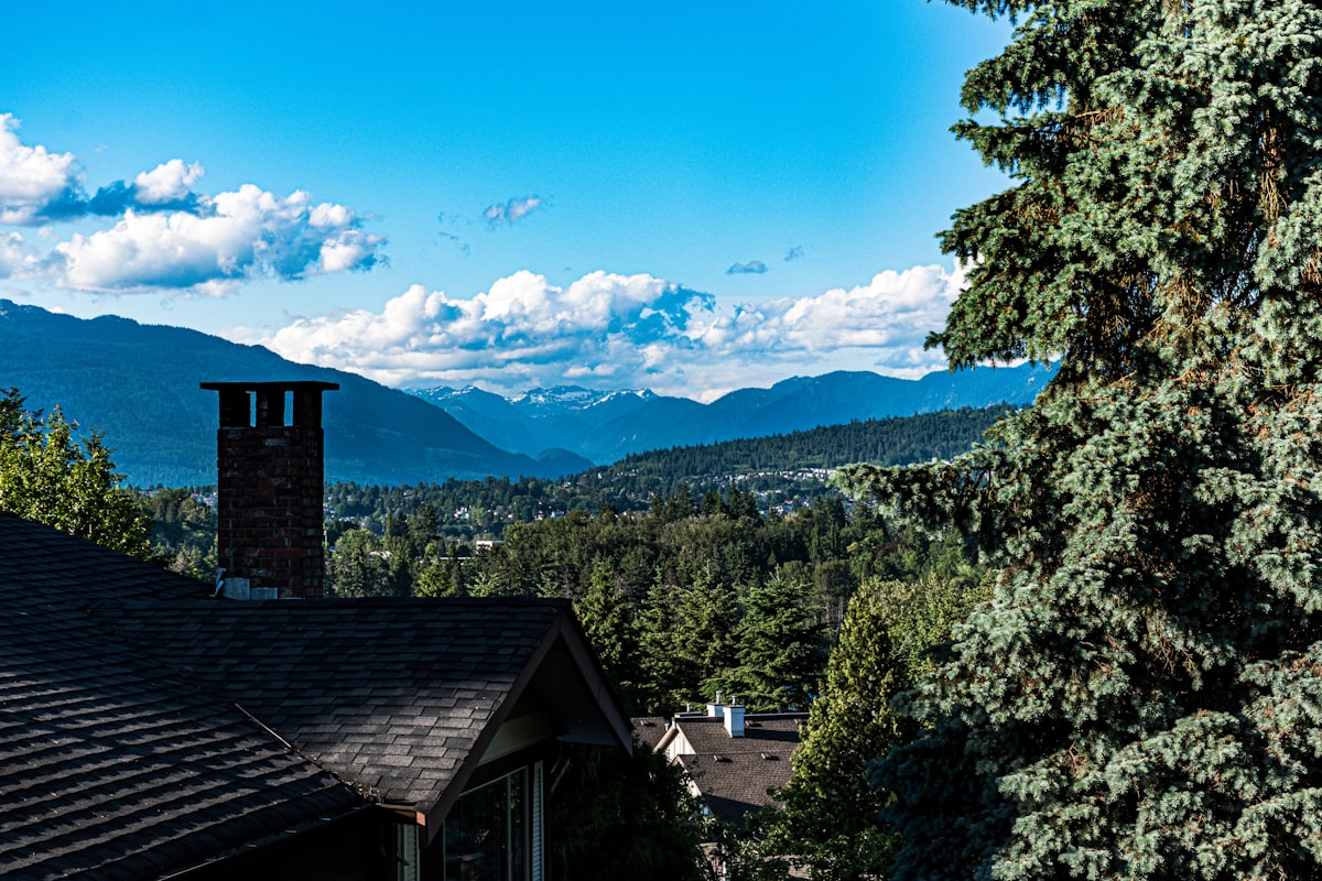 Aerial view of Abbotsford, BC with farmland and mountains