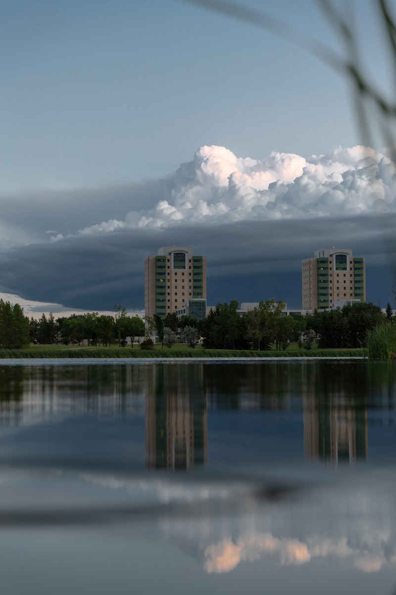 Regina city skyline reflected in Wascana Lake at dusk