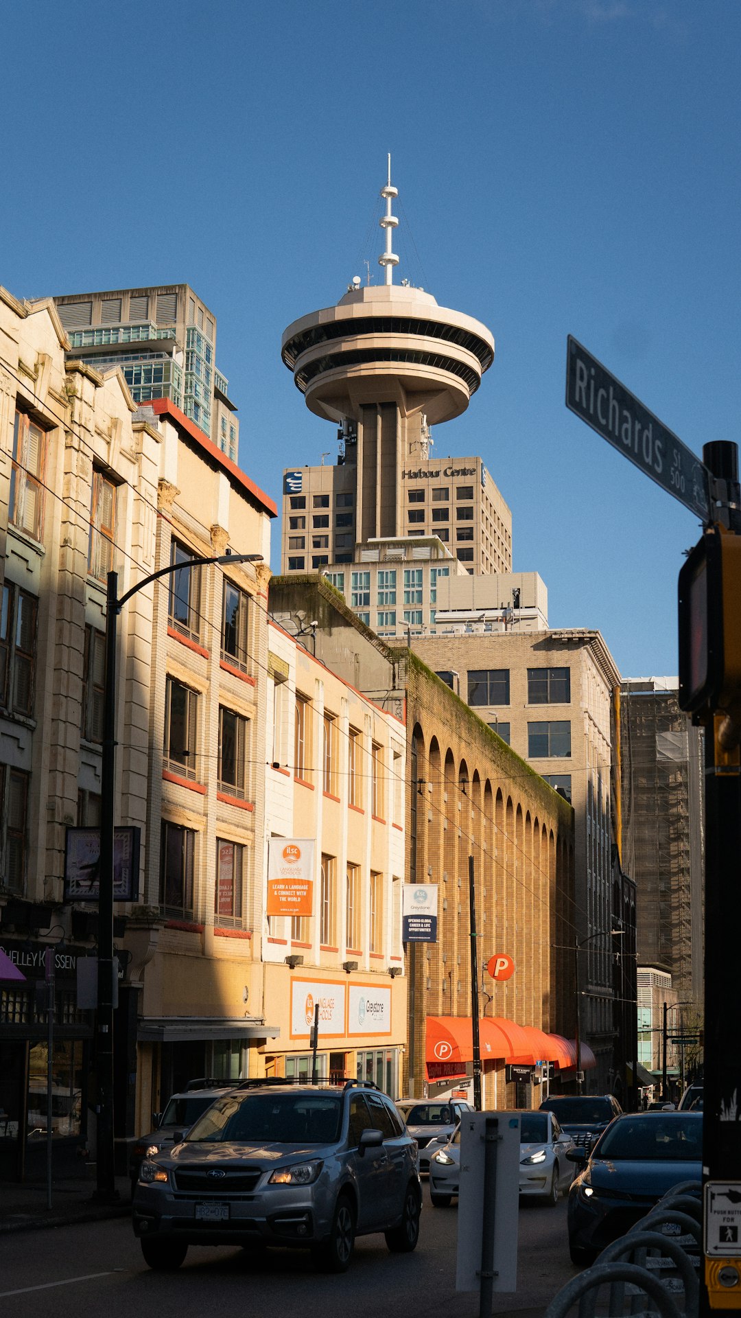 Vancouver city street with traffic and tall buildings