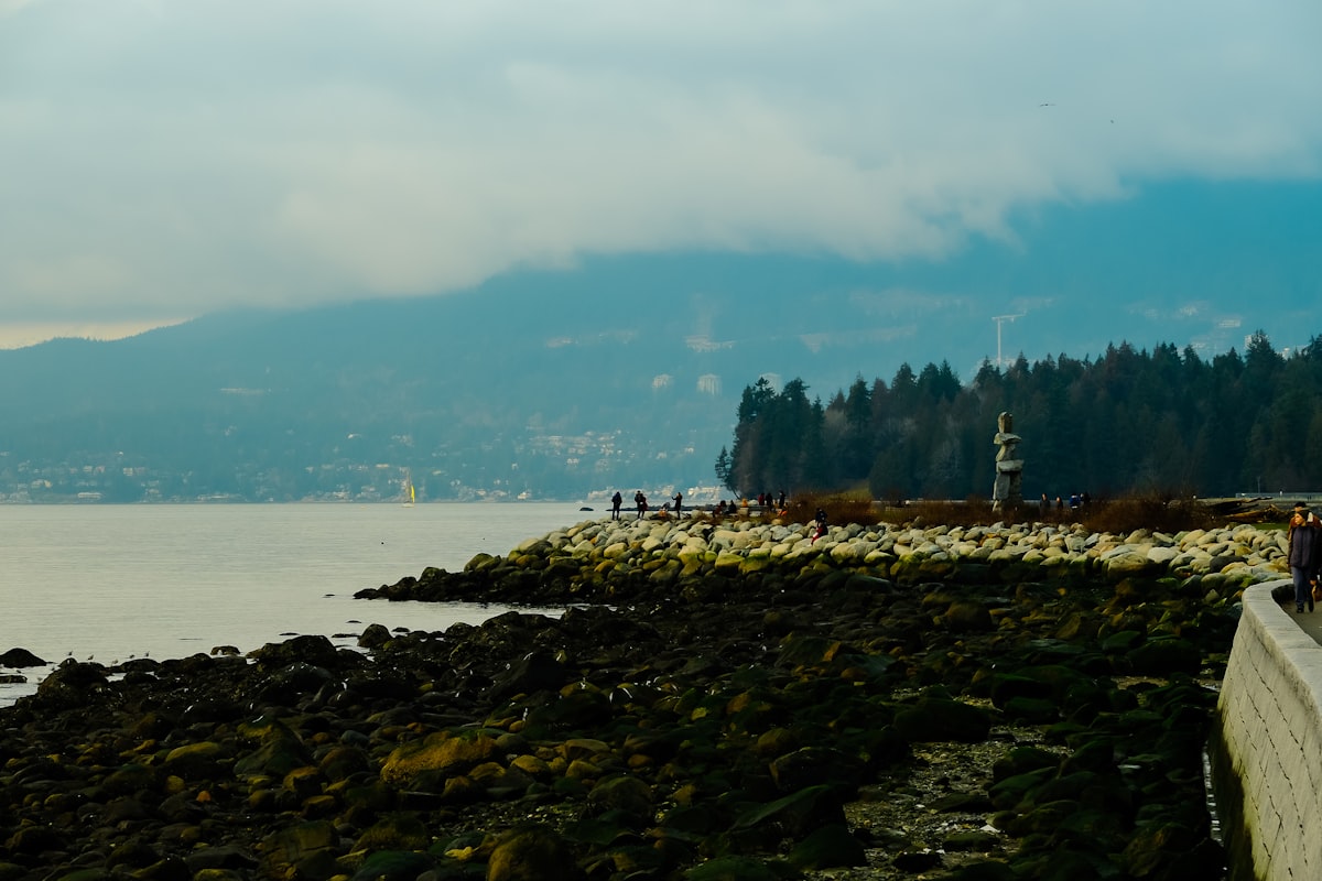 Vancouver seawall and waterfront with cyclists and mountains