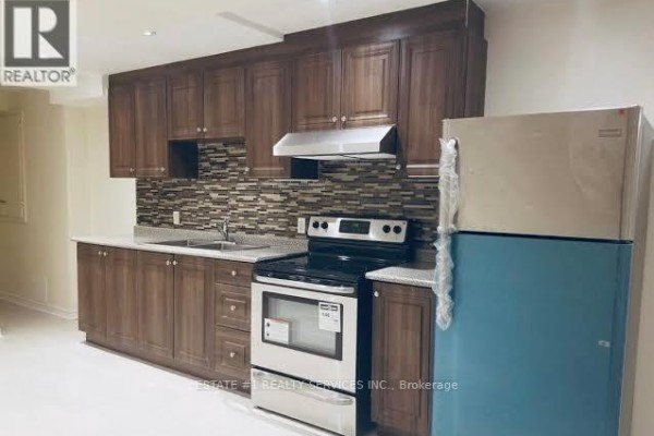 Bathroom featuring a walk-in shower, granite countertop, and modern fixtures - (bsmt) - 12 Locarno Street, Brampton