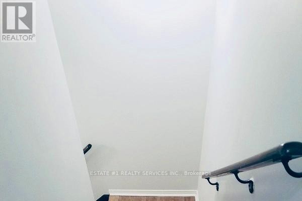 Larger room with mirrored closet, window, and laminate flooring - (bsmt) - 12 Locarno Street, Brampton