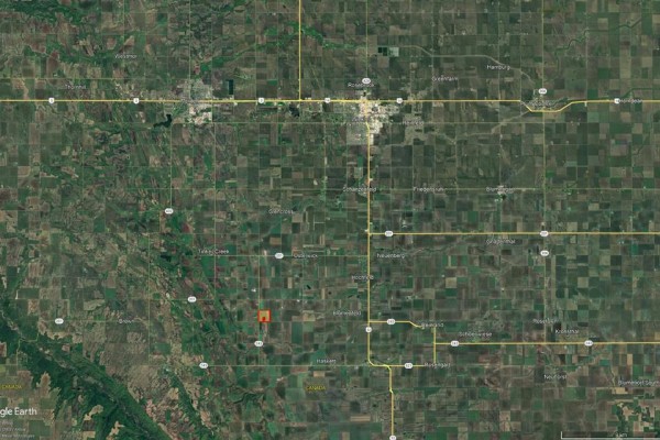 Satellite map showing the location of a farm property within a grid of agricultural fields near Morden, Manitoba. - , Morden