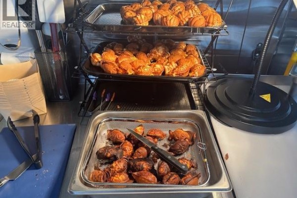 Trays of freshly baked pastries on display inside the food truck - . Cls Ave, Saanich