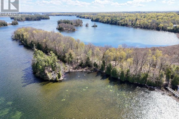 Aerial view of a tree-covered peninsula with small islands in the distance. - 0 Applewood Lane, Frontenac