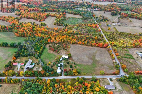 Aerial shot of the lot with surrounding trees and a clear sky, highlighting the fall landscape. - 0 Boundary Road, Frontenac