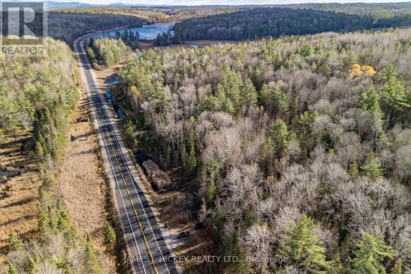 Aerial view of a highway cutting through a forested landscape with rolling hills. - 0 Hwy 17 Highway, Laurentian Hills