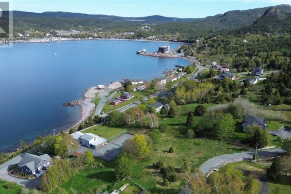 Aerial view of a seaside community with houses, trees, and a bay. - 0 Kennedy's Lane Unit#lot A, Holyrood