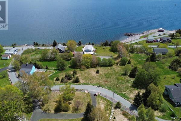 Aerial view of undeveloped land with houses and a bay in the distance. - 0 Kennedy's Lane Unit#lot A, Holyrood