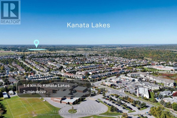 Aerial view of residential neighborhoods and schools near the property, indicating proximity to Kanata Lakes. - 00 Bradley Side Road, Ottawa