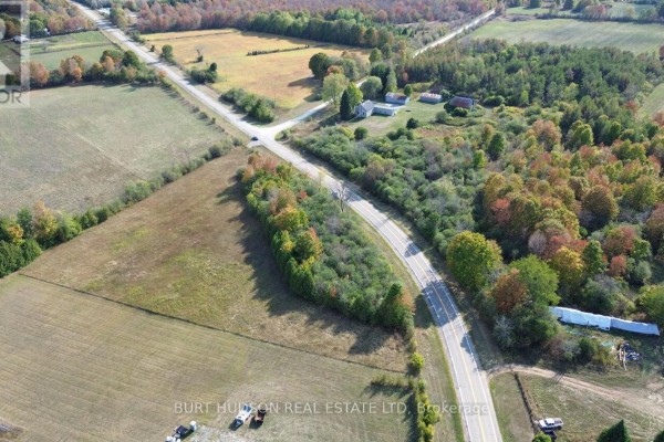 Aerial image showing intersecting roads with fields and wooded areas, highlighting the landscape layout. - 00 County Road 7 Road, Elizabethtown Kitley