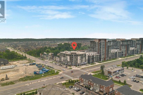 Aerial view of a commercial and residential development with surrounding suburban homes. - 06 - 10 Mallard Trail, Hamilton