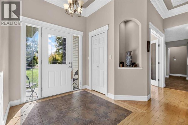 Interior entryway with a tiled floor, white double doors, white trim, and a recessed niche. - 1, 20120 Twp Rd 515 Road, Rural Beaver County