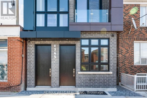 Interior staircase with white walls, grey metal handrails, and a concrete accent. - 1 - 1745 Keele Street, Toronto