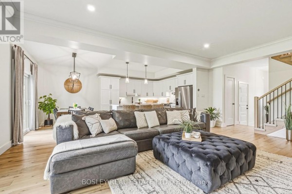Interior view of a bright entryway with white walls, tiled floor, and a dark grey front door. - 1 - 2727 Prince William Street, Lincoln