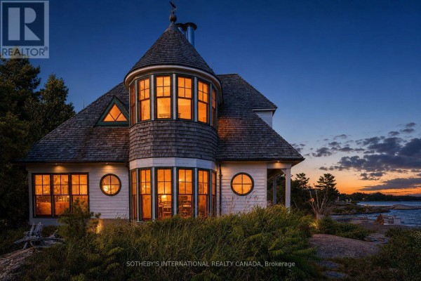 House with a turret and circular windows at dusk. - 1 A307 Island, The Archipelago