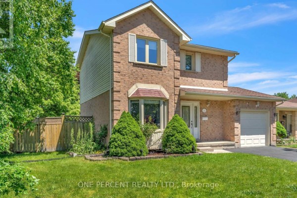 Side view of a two-story brick house with a bay window and green trees. - 1 Cheswick Circle, London South