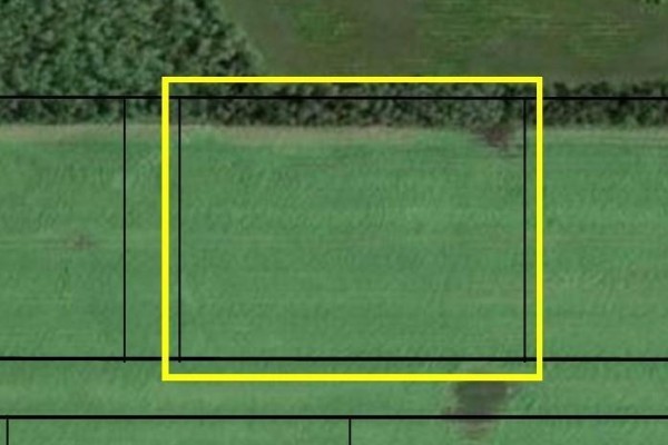 Close-up aerial view of a green field parcel with property lines. - 1 Mclennan Lane, St Clements