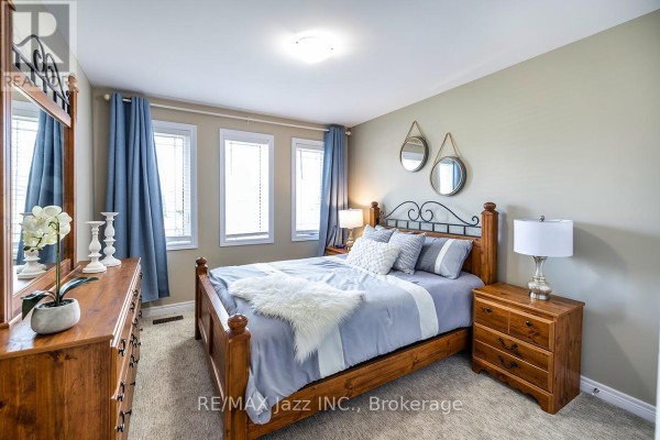 A room with blue walls, a glass dining table, four chairs, and a wooden display cabinet. - 1 Millpond Lane, Asphodel Norwood