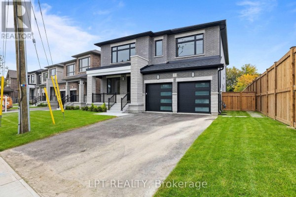 Street view of a modern two-story house with a two-car garage and driveway. - 1 Richmond Park Drive, Georgina
