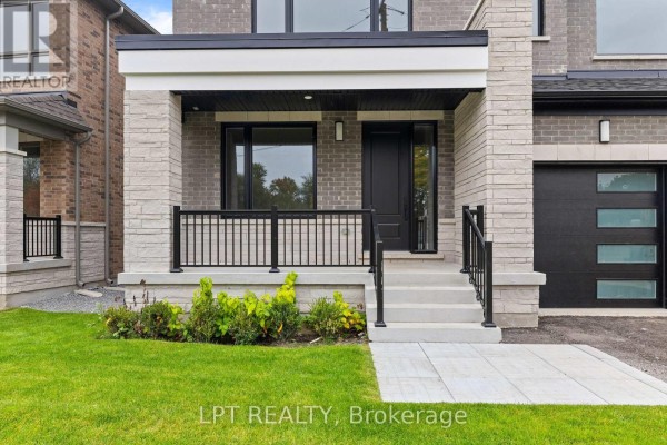 Close-up of the covered front porch entrance with steps and black railings. - 1 Richmond Park Drive, Georgina