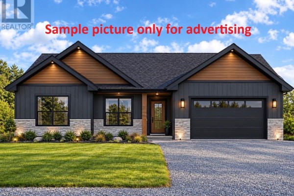 Modern single-story house with dark gray siding, stone accents, and black garage door. - 1 Southside Place, Bay Roberts