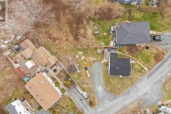 Overhead view of multiple residential properties with detached garages and backyards. - 1 Trelyn Road, Halifax