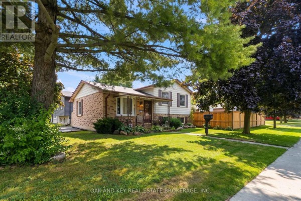 Front view of a modest house with a covered porch, entryway, and mailbox. - 1 Vanier Place, St  Thomas