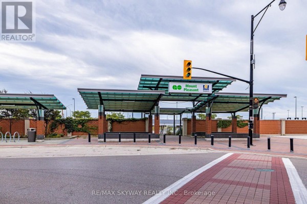 Mount Pleasant GO Transit station exterior with covered shelters and bike racks - 10 - 200 Veterans Drive, Brampton
