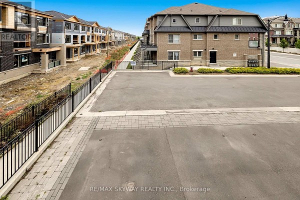 Modern brick townhome with balcony, paved parking, and new construction - 10 - 200 Veterans Drive, Brampton