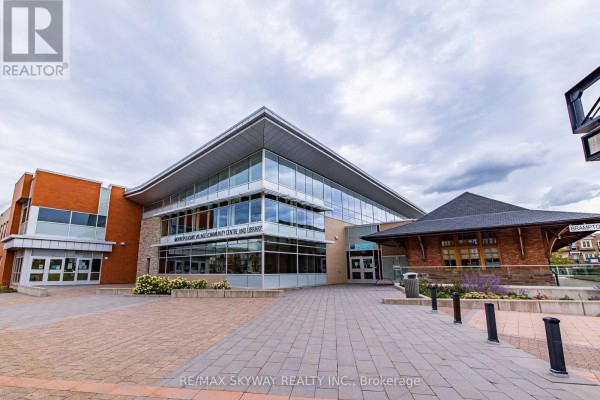 Mount Pleasant Village Community Centre and Library exterior with tiled plaza - 10 - 200 Veterans Drive, Brampton