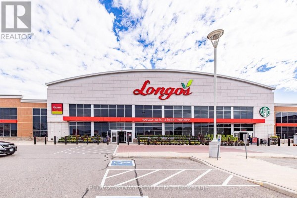 Longo's grocery store with Starbucks, parking lot, and large windows - 10 - 200 Veterans Drive, Brampton