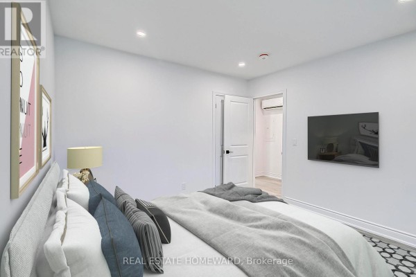Bedroom with a bed, a mounted television, and a doorway leading to an ensuite. - 10 - 419 Woodbine Avenue, Toronto