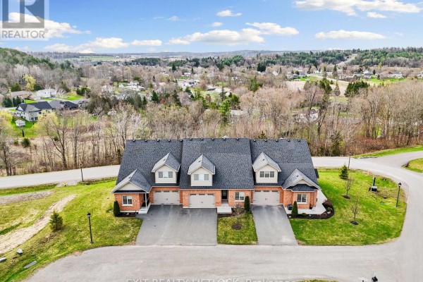 Aerial view of the townhouse complex and surrounding neighborhood in daylight. - 10 - 68 Blossom Court, Trent Hills