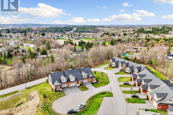 Direct overhead view of a section of the townhouse complex, showing garages and backyards. - 10 - 68 Blossom Court, Trent Hills