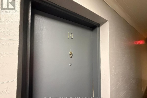 Close-up of apartment door with number 10 and a door knocker - 10 - 69 Old Mill Terrace, Toronto