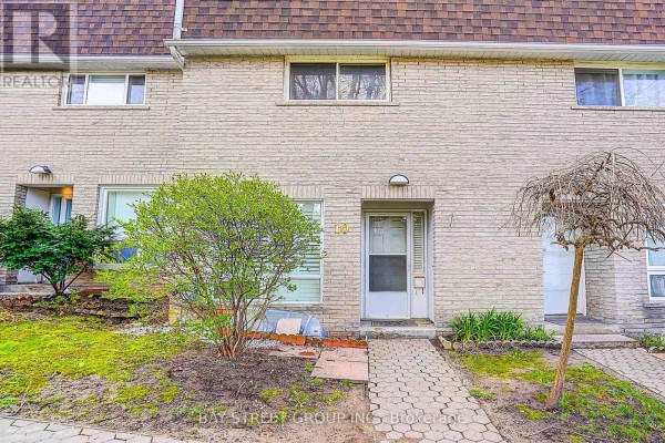 Exterior view of a townhouse complex with multiple units and brown shingled roofs. - 10 - 91 Rameau Drive, Toronto