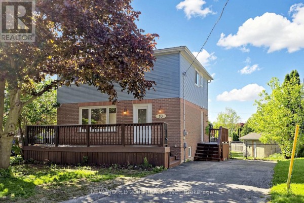 Side view of the brick and vinyl house showing driveway and backyard access. - 10 Buce Avenue, Bradford West Gwillimbury