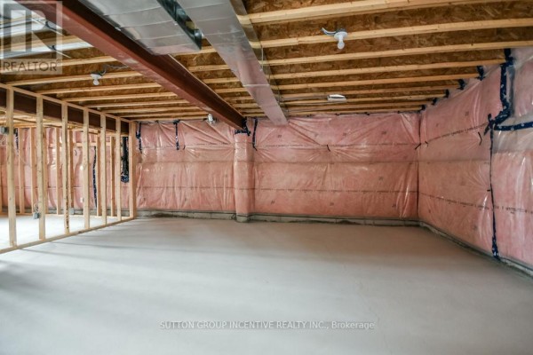 Unfinished basement framing with exposed ductwork, beams, and insulation. - 10 Cottonwood Street, Springwater