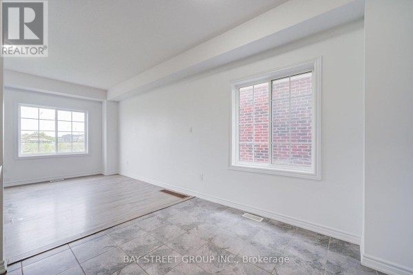 Open-concept living area with kitchen view - 10 Elsegood Drive Guelph