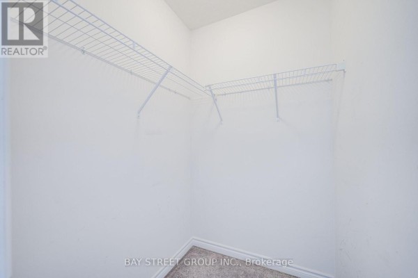 Empty bedroom with dual-pane windows and carpet - 10 Elsegood Drive Guelph