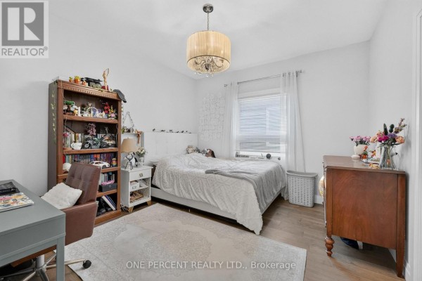 Bedroom with bed, bookshelf, desk, and dresser - 10 Granite Street Clarence Rockland