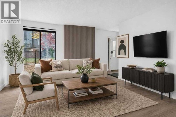Living room - 100, 2519 38 Street Ne, Calgary, AB T1Y4W8 Photo 2