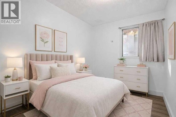 Primary Bedroom - 100, 2519 38 Street Ne, Calgary, AB T1Y4W8 Photo 5