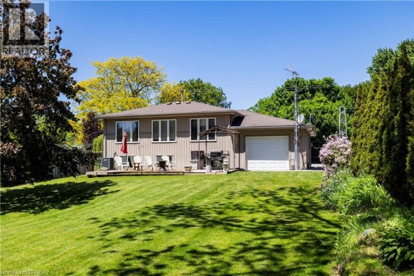 Backyard with deck, grill, and garage - 100 Mechanic Street W Waterford