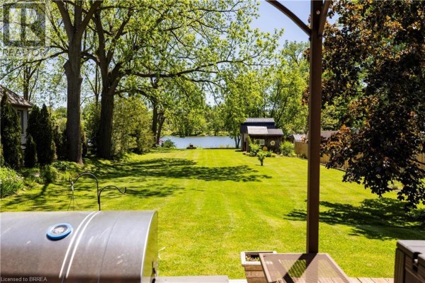 Backyard with grill, shed, and waterfront view - 100 Mechanic Street W Waterford