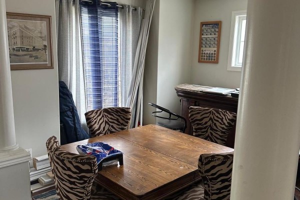 Wooden dining table with zebra-print chairs and crystal chandelier - 100 Southview Court Woodstock